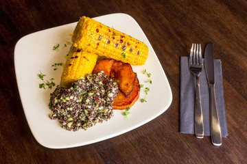 White dish with delicious corn and quinoa porridge