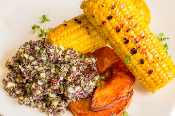 White dish with delicious corn and quinoa porridge