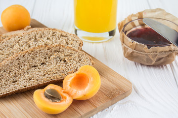 fresh bread, fruit and jam for breakfast