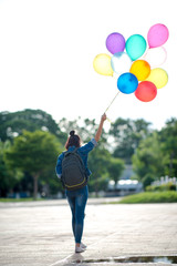the tourist with multi-color balloon and blue sky.