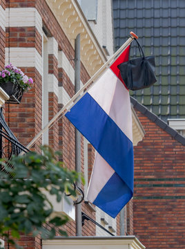 Dutch flag with satchel, school bag, a tradition when a student celebrates graduation