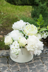White peony bouquet in white vase