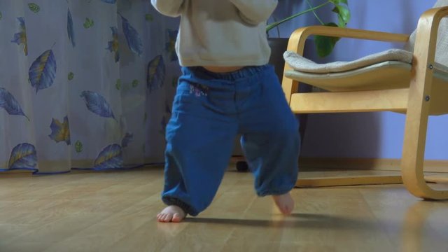 Wonderful Blue-eyed Child Takes A Mobile Phone And Makes First Hesitant Steps