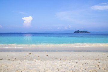 Fototapeta na wymiar Beautiful beach and tropical sea with clear sky
