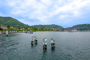 holidays in Italy - a view of the most  beautiful lake in Italy, Lago di Como. Harbor in Como city on cloudy day.