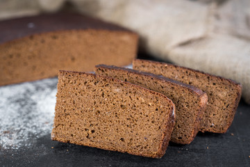 Sweet rye bread on wooden background