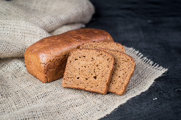 Sweet rye bread on wooden background