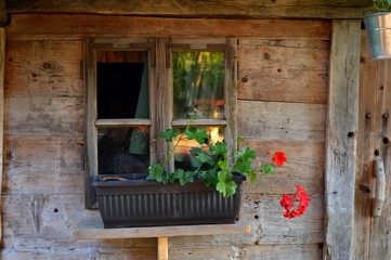 Fototapeta na wymiar window of the old wooden house 