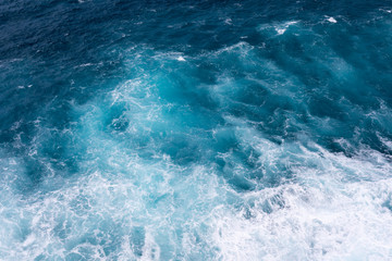 Fototapeta na wymiar The texture of splashes of sea water on the shore