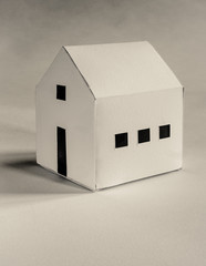 white cardboard hand made paper work house