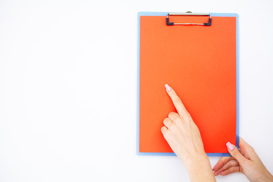 Blank Folder with Оrange Paper. Hand that Holding Folder and Handle on White Background. Copyspace. Place for Text.