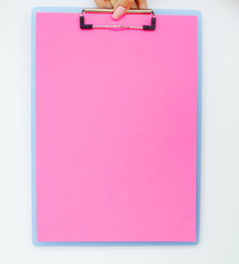 Blank Folder with Pink Paper. Hand that Holding Folder and Handle on White Background. Copyspace. Place for Text.