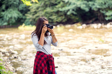 Young female photographer outdoor