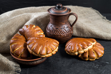 Sweet tasty buns on black background