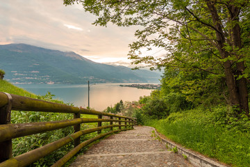 Obraz premium a view of the most beautiful lake in Italy, Lago di Como. Photo taken from a hill near San Rocco church at sunset