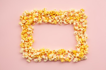 Food. Frozen Popcorn Corn Delicious Yellow Popcorn on Pink Background. Cinema. Copyspace. Place for Text.