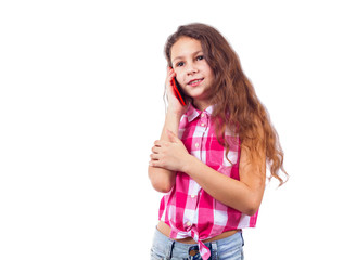 Cute little girl talking on the phone and smiling