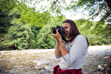 Young female photographer outdoor