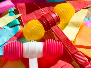 Bright colorful plastic toy hammers and bunting for celebrating the feast of St. John the Baptist in Porto, Portugal