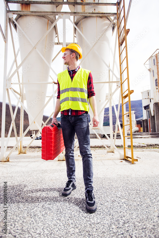 Wall mural technician with tool box on work