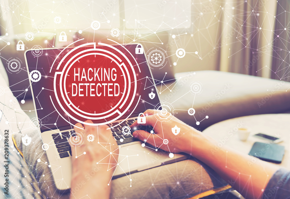 Poster hacking detected with person using a laptop computer