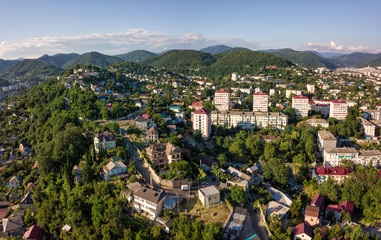 Fototapeta na wymiar Aerial drone view on Tuapse city and hills on horizone at day time in summer