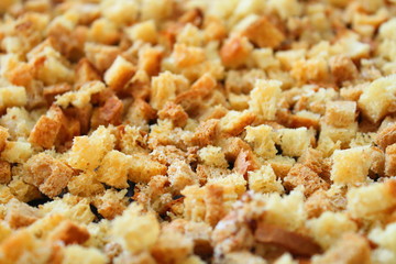 Rusks. Dried bread in the oven, cut into small cubes.