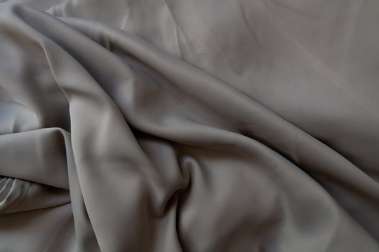 Crumpled Grey Silk Fabric Background