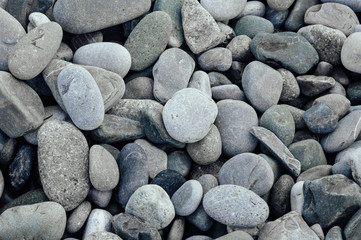 Gray stones close-up. Minimalistic background. Pebble beach.