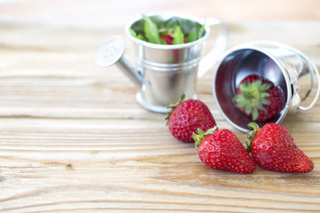 strawberries on wooden background