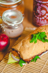 Banh mi Vietnamese sandwich with ham, pate, cilantro, and carrot