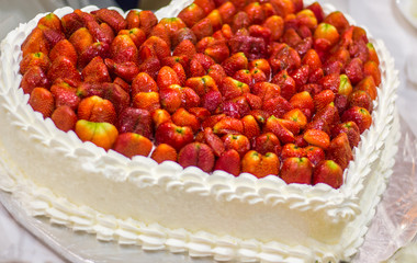 heart shaped wedding cake with strawberries