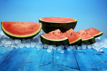 watermelon on blue background. juicy summer fruit in slices
