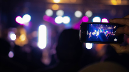 People holding their smart phones and photographing concert. Open air Rock Festival in Germany
