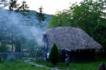 old wooden house and smoke
