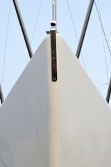 Fototapeta premium Bow and hull of a sailboat on a trailer in a marina