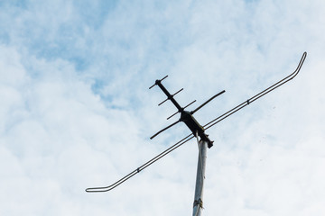 Outdors TV antenna on a cloudy sky