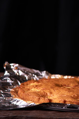 apricot pie baked in foil with ingredients cinnamon, abricot, eggs, flour, milk and sugar