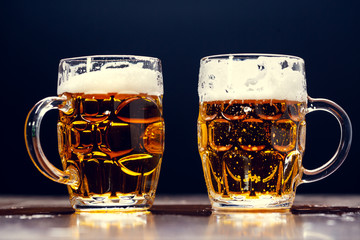 delicious beer in a glass of beer on an oak counter