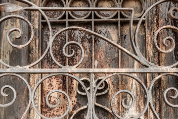 Ornate Rusted wrought iron cemetery gate and door. What the Gate to Hell might look like I