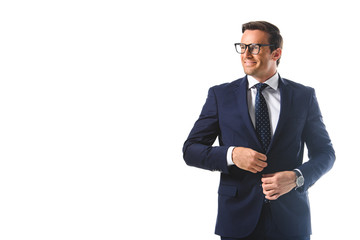 happy businessman in eyeglasses adjusting jacket isolated on white background