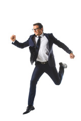 excited businessman in eyeglasses jumping and gesturing by hands isolated on white background