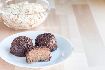 Swedish sweets Arrack balls, made from cookie crumbs, cocoa, butter and coconut wine Arrack flavour, horizontal, copy space