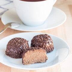 Swedish sweets Arrack balls, made from cookie crumbs, cocoa, butter and coconut wine Arrack flavour, square format