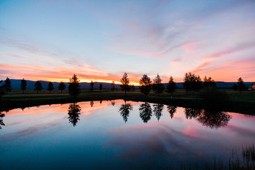 Fototapeta na wymiar Sunrise over a Pond in the Rock Mountains