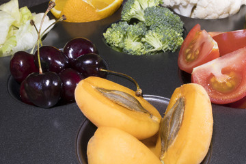 fruit, greens, vegetables in wooden tray, top view, selective focus. Detox, dieting, clean eating, vegetarian, vegan, fitness, healthy lifestyle concept. fruits and vegetables on tray