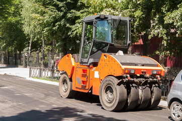 machine for laying asphalt, in the city during repair work