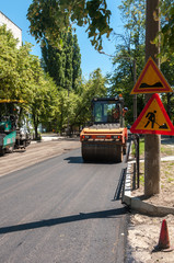 Fototapeta na wymiar piling expensive new asphalt in the city