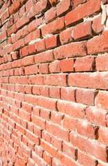 Obraz premium Masonry: Old retaining brick wall with flushed out joints in Eastern Germany