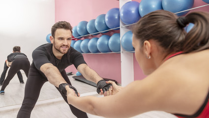 Fototapeta na wymiar Couple Training in a Gym